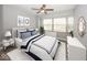 Main bedroom with large windows, ceiling fan and neutral decor at 3965 N Meridian St # Apt 2A, Indianapolis, IN 46208