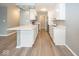 Modern kitchen with white cabinetry, quartz countertops, and wood flooring at 3965 N Meridian St # Apt 2A, Indianapolis, IN 46208