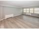 Large living room featuring hardwood floors and ample natural light at 3965 N Meridian St # Apt 2A, Indianapolis, IN 46208