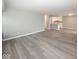 Open concept living room and kitchen with gray walls and wood-look floors at 3965 N Meridian St # Apt 2A, Indianapolis, IN 46208