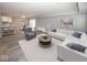 Open living room and kitchen with hardwood floors and modern furniture at 3965 N Meridian St # Apt 2A, Indianapolis, IN 46208