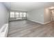 Bright living room with hardwood floors and large windows at 3965 N Meridian St # Apt 2A, Indianapolis, IN 46208