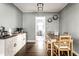 Dining area with a wooden table and chairs, view to the kitchen at 5133 Crittenden Ave, Indianapolis, IN 46205