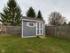 Gray shed with white trim in fenced backyard at 6024 Boulder Dr, Anderson, IN 46013