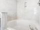 Clean bathtub with marble-like wall surrounds at 6415 Kelsey Dr, Indianapolis, IN 46268