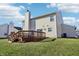 Two-story house with backyard deck and grassy lawn at 6415 Kelsey Dr, Indianapolis, IN 46268