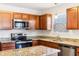 Kitchen features granite countertops and stainless steel appliances at 6415 Kelsey Dr, Indianapolis, IN 46268