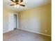 Bright bedroom with ceiling fan and large closet at 8265 Plumwood Ln, Indianapolis, IN 46256