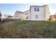 Large backyard with grassy lawn and wooden fence at 8442 Burket Way, Camby, IN 46113