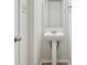 Clean bathroom with pedestal sink and mirror at 8442 Burket Way, Camby, IN 46113