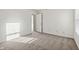 Well-lit bedroom with neutral carpeting and window at 8442 Burket Way, Camby, IN 46113