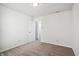 Spacious bedroom with neutral carpeting and door to hallway at 8442 Burket Way, Camby, IN 46113