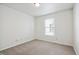 Bright bedroom with neutral carpeting and large window at 8442 Burket Way, Camby, IN 46113