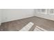 Sunny bedroom with neutral carpeting and window at 8442 Burket Way, Camby, IN 46113