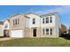 Two-story brick and vinyl home with a white garage door and landscaping at 8442 Burket Way, Camby, IN 46113