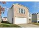 Brick and vinyl home with a white garage door and partial yard view at 8442 Burket Way, Camby, IN 46113