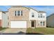 Two-story brick and vinyl home with a white garage door and landscaping at 8442 Burket Way, Camby, IN 46113