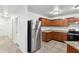 Kitchen features stainless steel appliances and wood cabinets at 8442 Burket Way, Camby, IN 46113