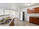 Kitchen with stainless steel refrigerator and granite countertops at 8442 Burket Way, Camby, IN 46113