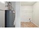 Laundry area with a water heater and shelving at 8442 Burket Way, Camby, IN 46113