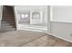 Bright living room with carpeted floor, high ceilings, and natural light at 8442 Burket Way, Camby, IN 46113