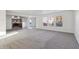 Spacious living room with carpeted floor and kitchen views at 8442 Burket Way, Camby, IN 46113