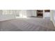 Open living room with carpeted floor and kitchen access at 8442 Burket Way, Camby, IN 46113