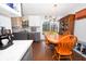 Kitchen dining area with wood table and chairs, and access to backyard at 8523 Farmhill Rd, Indianapolis, IN 46231