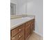 Bathroom vanity with tan countertop, wooden cabinets, and mosaic tile accents at 1325 Odell Ln, Greenwood, IN 46143