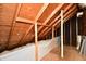 Unfinished attic space with plywood flooring and exposed beams at 1500 S Anderson St, Elwood, IN 46036