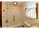 Simple bathroom with white tile and shower/tub combo at 1500 S Anderson St, Elwood, IN 46036