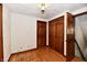 Simple bedroom with hardwood floors and double closets at 1500 S Anderson St, Elwood, IN 46036