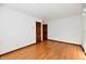 Hardwood floor bedroom with wood door at 1500 S Anderson St, Elwood, IN 46036