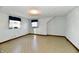 Simple bedroom with two windows and wood-toned flooring at 1500 S Anderson St, Elwood, IN 46036