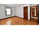 Spacious bedroom with hardwood floors and window at 1500 S Anderson St, Elwood, IN 46036