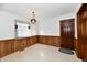 Small dining area with wood paneling and a window at 1500 S Anderson St, Elwood, IN 46036
