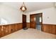 Dining area with wood wall paneling and tile floor at 1500 S Anderson St, Elwood, IN 46036