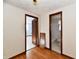 Hallway with wood floors and access to bedroom and bathroom at 1500 S Anderson St, Elwood, IN 46036