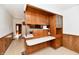 Retro kitchen with wood cabinets, a white countertop and a pass through to another room at 1500 S Anderson St, Elwood, IN 46036