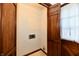Small laundry area with wooden cabinets and hookups at 1500 S Anderson St, Elwood, IN 46036