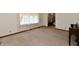 Living room with neutral carpeting and large window at 1500 S Anderson St, Elwood, IN 46036