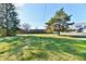 Large lot with a grassy area and mature trees at 1500 S Anderson St, Elwood, IN 46036