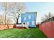 Large backyard with a deck and a blue house at 2318 E Brookside Ave, Indianapolis, IN 46218