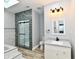Updated bathroom features a vanity, toilet and walk-in shower at 2318 E Brookside Ave, Indianapolis, IN 46218