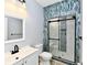 Bathroom with glass shower, white vanity, and modern tile at 2318 E Brookside Ave, Indianapolis, IN 46218