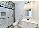 Bathroom with walk-in shower, toilet and vanity at 2318 E Brookside Ave, Indianapolis, IN 46218