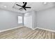 Bedroom with ceiling fan, hardwood floor, and closet at 2318 E Brookside Ave, Indianapolis, IN 46218