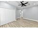 Bedroom with ceiling fan, hardwood floor, and closet at 2318 E Brookside Ave, Indianapolis, IN 46218
