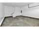 Spacious garage with concrete floor and overhead door at 2318 E Brookside Ave, Indianapolis, IN 46218