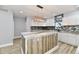Modern kitchen with white cabinets, granite countertops, and a large island at 2318 E Brookside Ave, Indianapolis, IN 46218